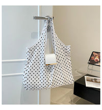 White polka dot bag